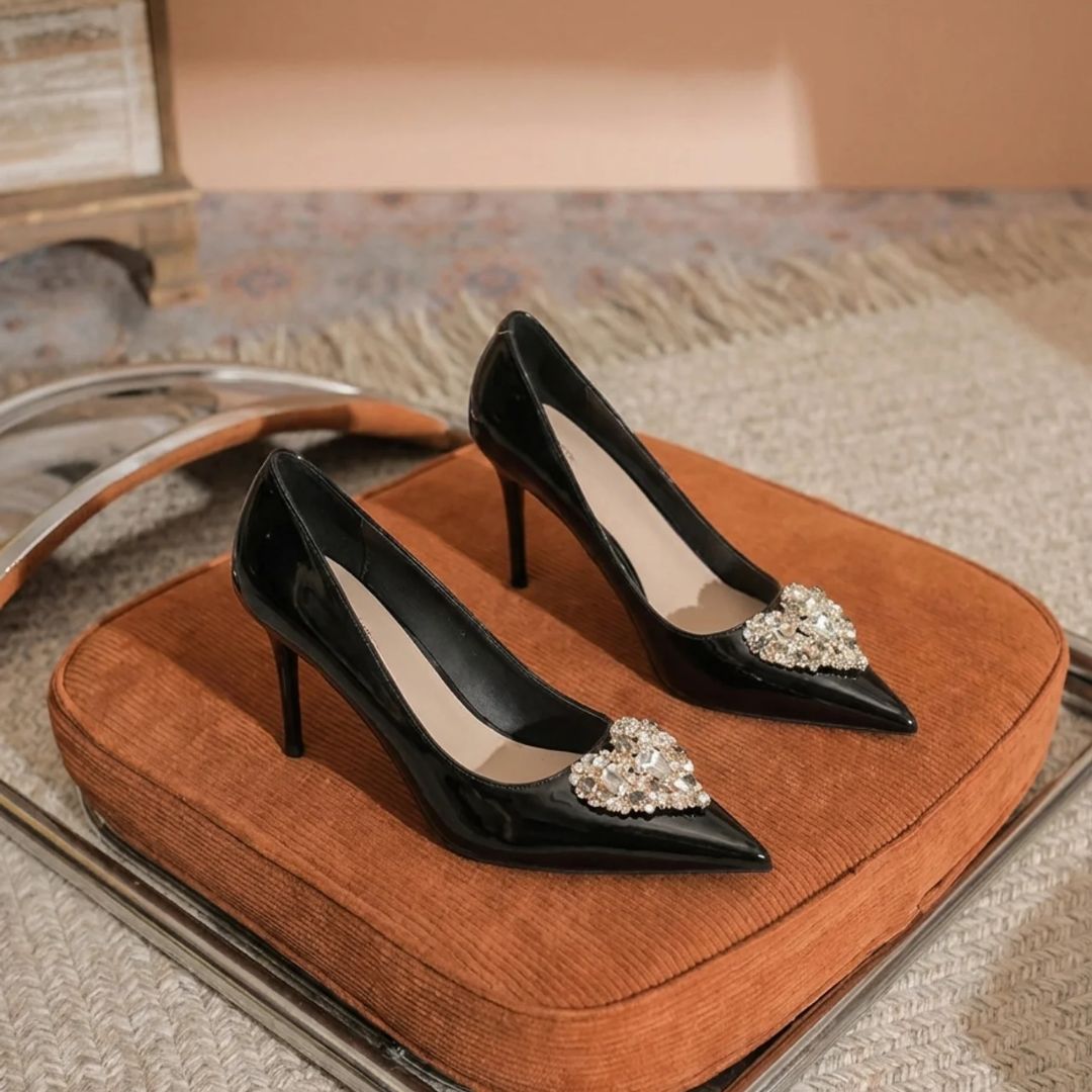 Swag black patent stiletto heels with diamond brooch - front view