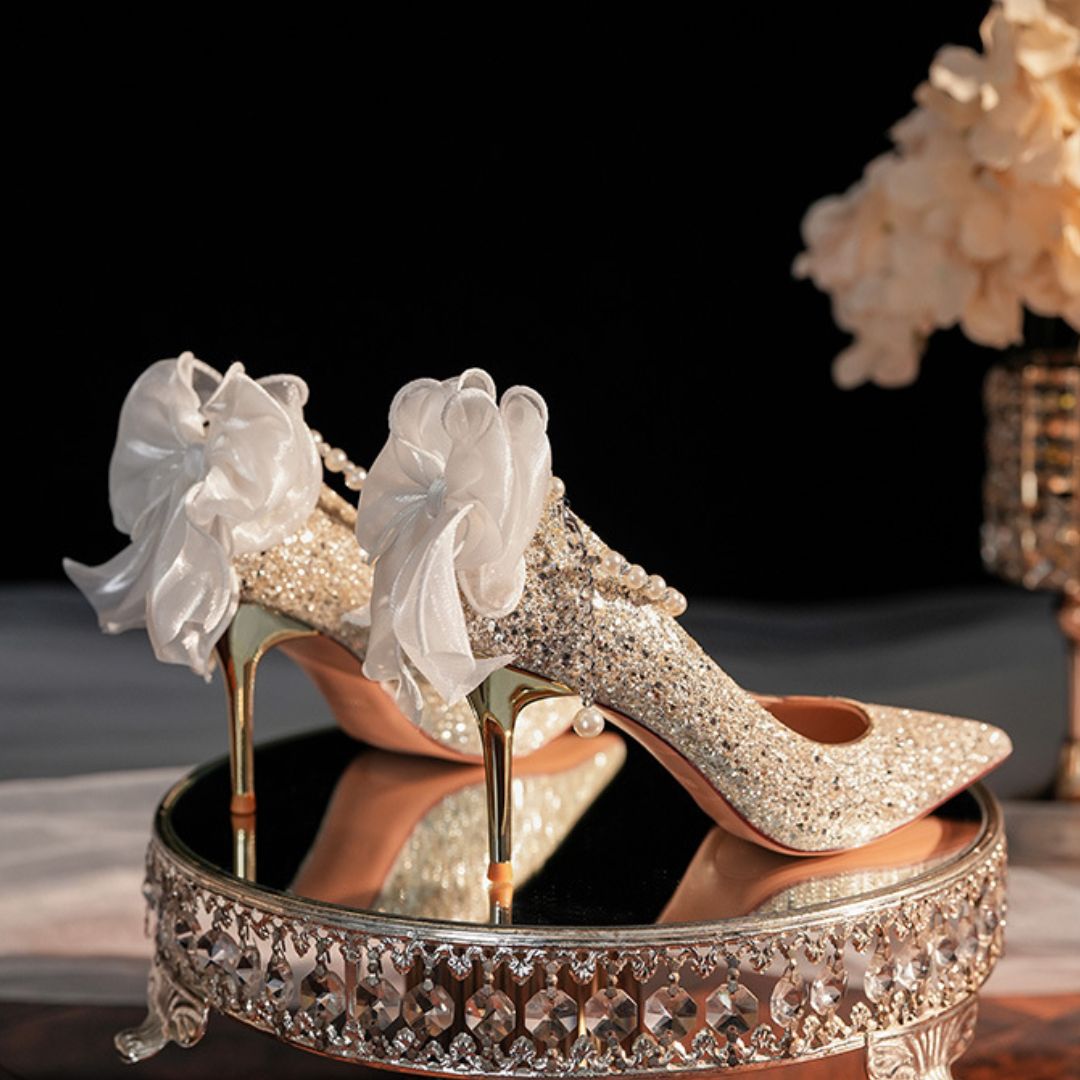 Bahar champagne gold stiletto heel height and sole view