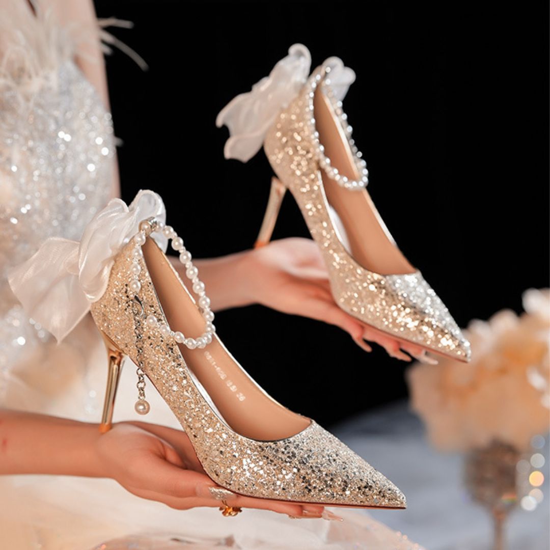 Bahar champagne gold glitter bridal stiletto heels with pearl strap - front view