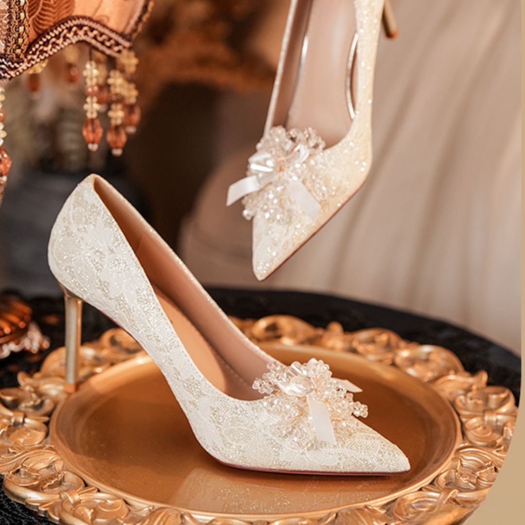 Heera Phool ivory lace bridal stiletto heels with pearl brooch - front view