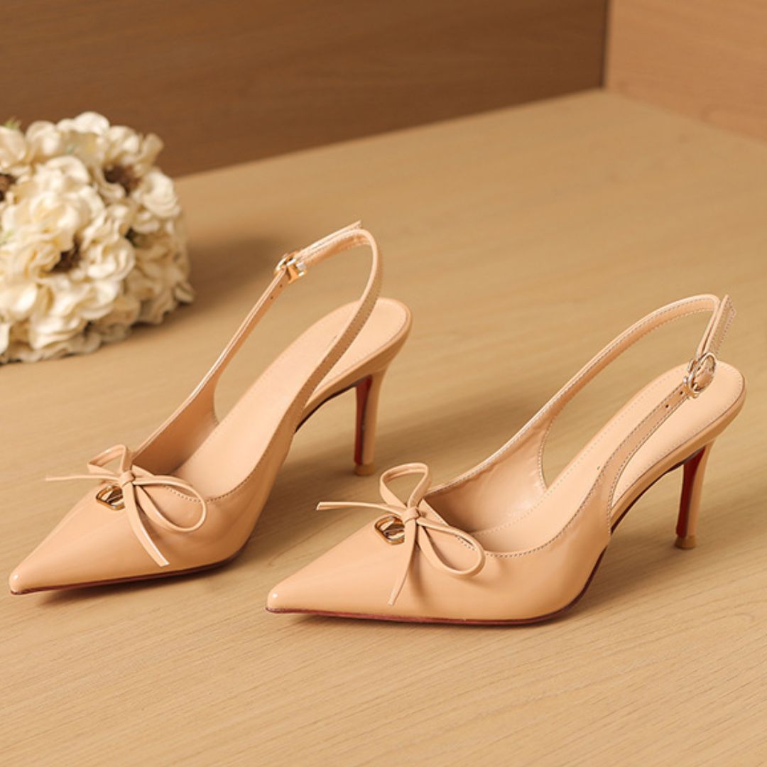 Glossed Edge nude slingback stiletto heels with bow and red sole - front view
