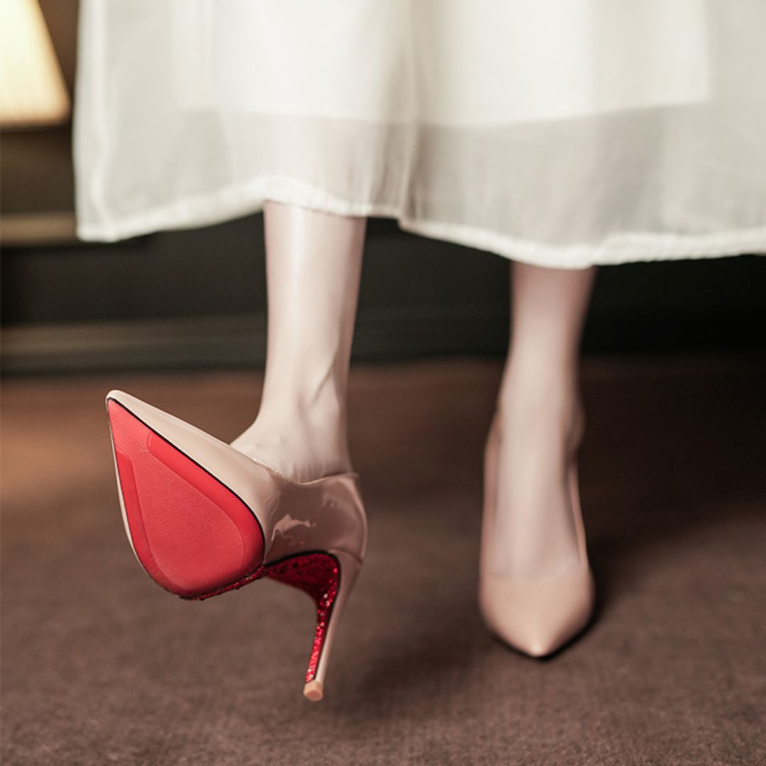 Nude high-heeled shoes with red glittery soles